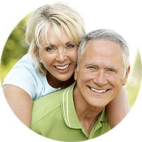 Elderly couple smiling after cataracts treatment