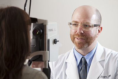 Eye Doctor Diagnosing Cataracts