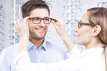 Man being fitted with eyeglasses