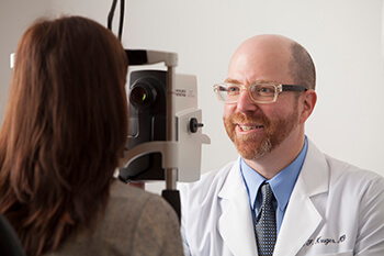 Eye Doctor examining a patient's Retina