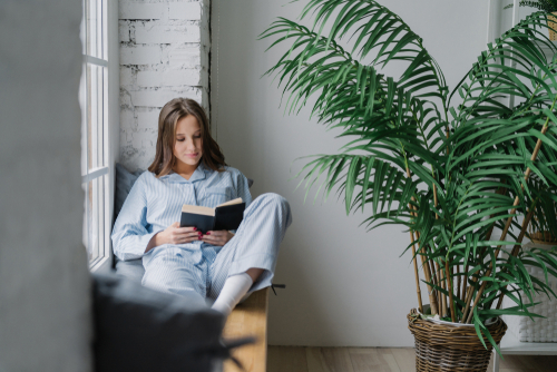 Young woman reading about LASIK