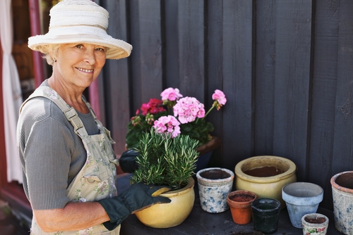 Older woman with cataracts working with plants