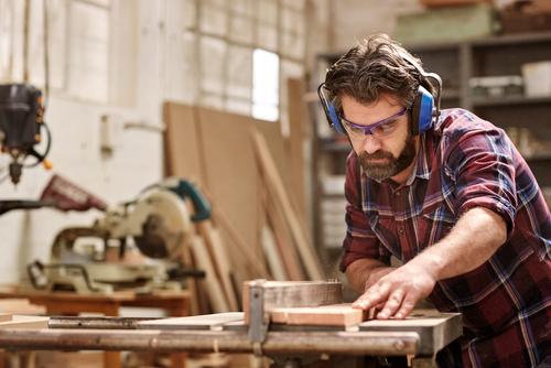 Man cutting wood