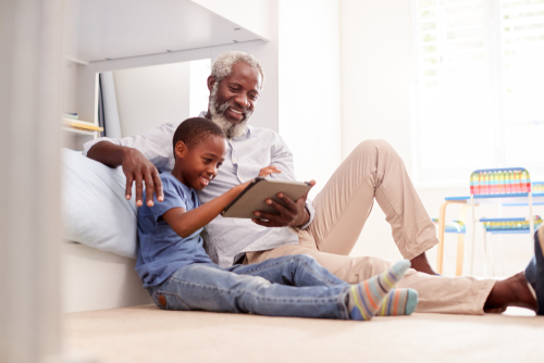 grandfather and grandson using ipad